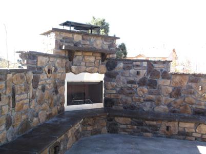Outdoor Living Space with Cultured Stone by Deck Works in Colorado Springs