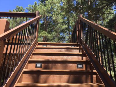 Deck with Stairway, Custom Rail & Accent Lighting by Deck Works in Colorado Springs