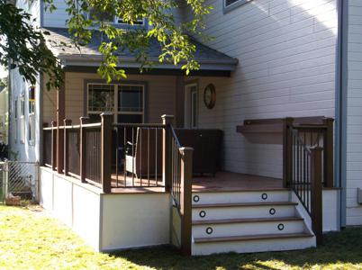Composite Deck with Iron Rail, Shelf, Accent Lighting & Deck Cover by Deck Works in Colorado Springs