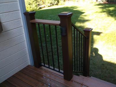 Composite Deck with Iron Rail, Shelf, Accent Lighting & Deck Cover by Deck Works in Colorado Springs
