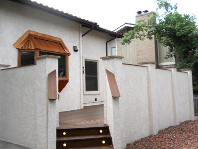 Deck with Stucco Walls and Accent Lighting by Deck Works in Colorado Springs