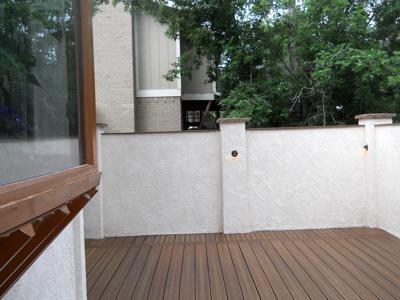 Deck with Stucco Walls and Accent Lighting by Deck Works in Colorado Springs