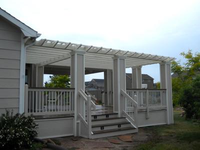 Composite Deck with Pergola, Deck Cover, Custom Rail & Accent Lighting by Deck Works in Colorado Springs