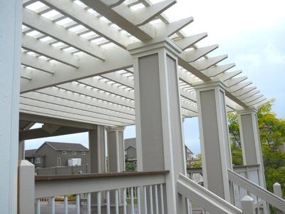 Composite Deck with Pergola, Deck Cover, Custom Rail & Accent Lighting by Deck Works in Colorado Springs