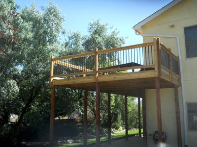 Hardwood Deck with Stairway, Custom Rail & Accent Lighting by Deck Works in Colorado Springs