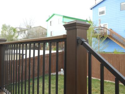 Composite Deck with Iron Rails & Accent Lighting by Deck Works in Colorado Springs