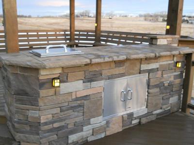 Stone & Composite Patio With Jacuzzi Cover built by Deck Works in Colorado Springs