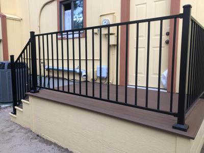 Composite Porch with Iron Rail built by Deck Works in Colorado Springs