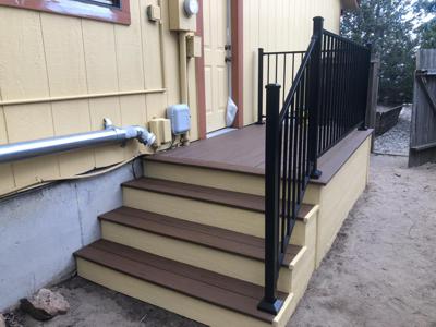 Composite Porch with Iron Rail built by Deck Works in Colorado Springs