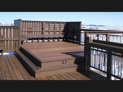 Multi Level Deck with Stairway, Benches, Custom Rail & Accent Lighting built by Deck Works in Colorado Springs