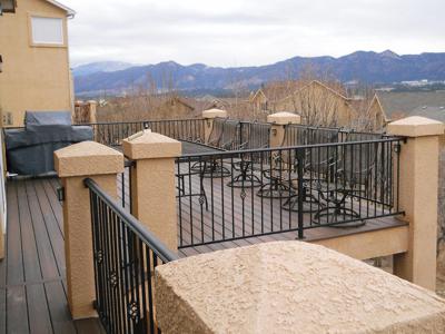 Stucco Deck with Stairway, Iron Rail & Accent Lighting built by Deck Works in Colorado Springs