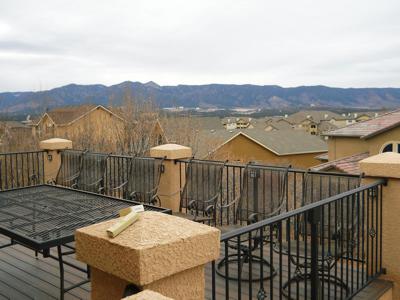 Stucco Deck with Stairway, Iron Rail & Accent Lighting built by Deck Works in Colorado Springs