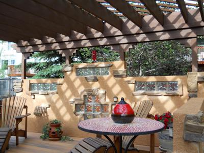 Covered Patio with Outdoor Living Area and Accent Lighting built by Deck Works in Colorado Springs