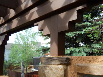 Covered Patio with Outdoor Living Area and Accent Lighting built by Deck Works in Colorado Springs