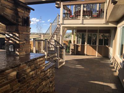 Multi Level Outdoor Living Space with Stone, Decorative Concrete & Composite Decks built by Deck Works in Colorado Springs