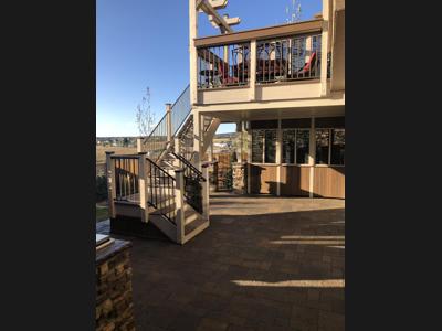 Multi Level Outdoor Living Space with Stone, Decorative Concrete & Composite Decks built by Deck Works in Colorado Springs