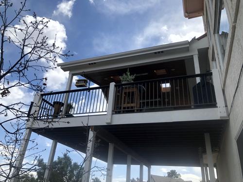 Covered Deck with Iron Rails Built by Deck Works in Colorado Springs