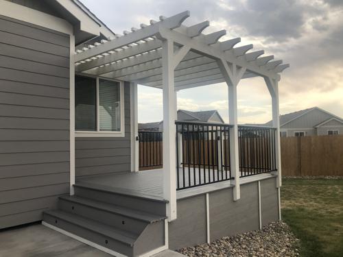 Composite Deck with Iron Rails & Pergola Built by Deck Works in Colorado Springs