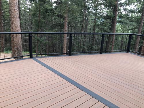 Composite Deck with Ramp, Iron Rail and Accent Lights Built by Deck Works in Colorado Springs