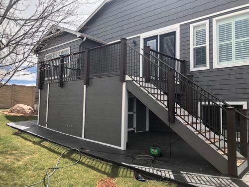 Composite Deck with Iron Rail, Stairways and Storage Space Built by Deck Works in Colorado Springs