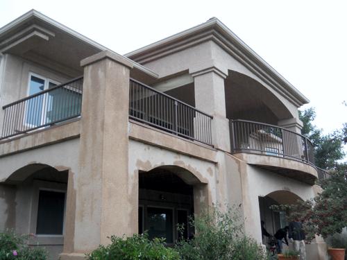 Stucco Deck with Cover & Iron Rails Built by Deck Works in Colorado Springs